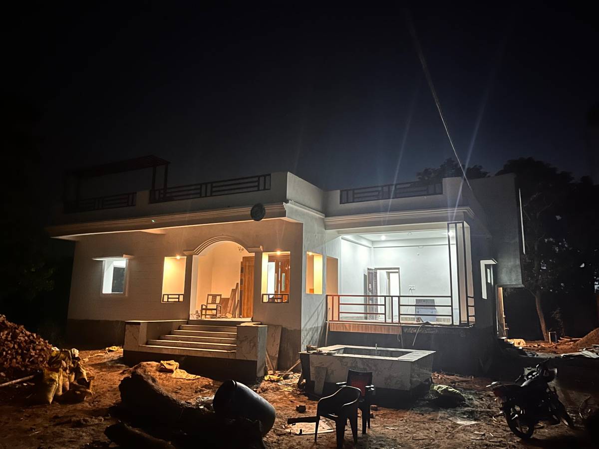 Finished house lit at night with warm interior lights